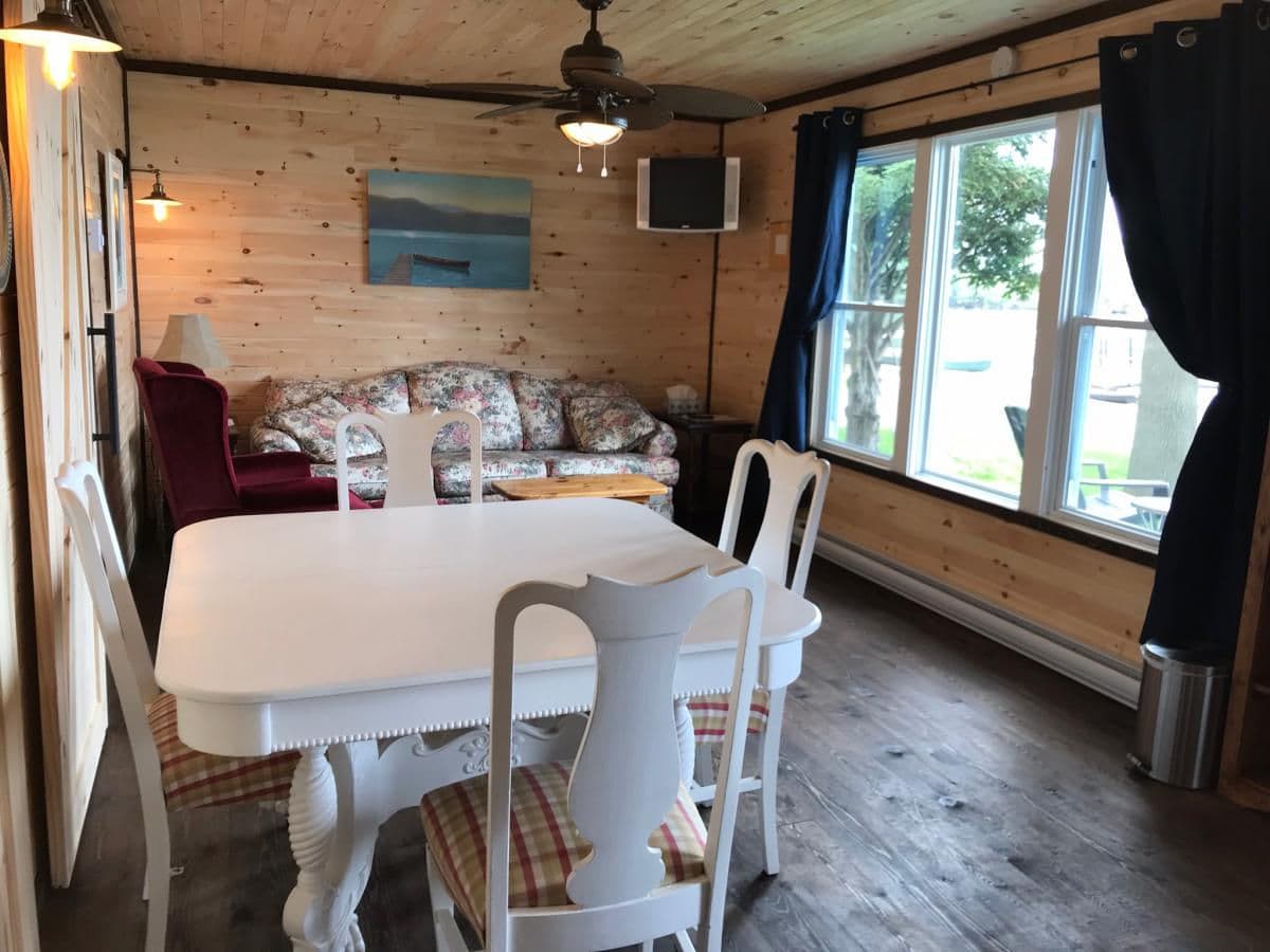 Interior view of a cottage dining and sitting area.